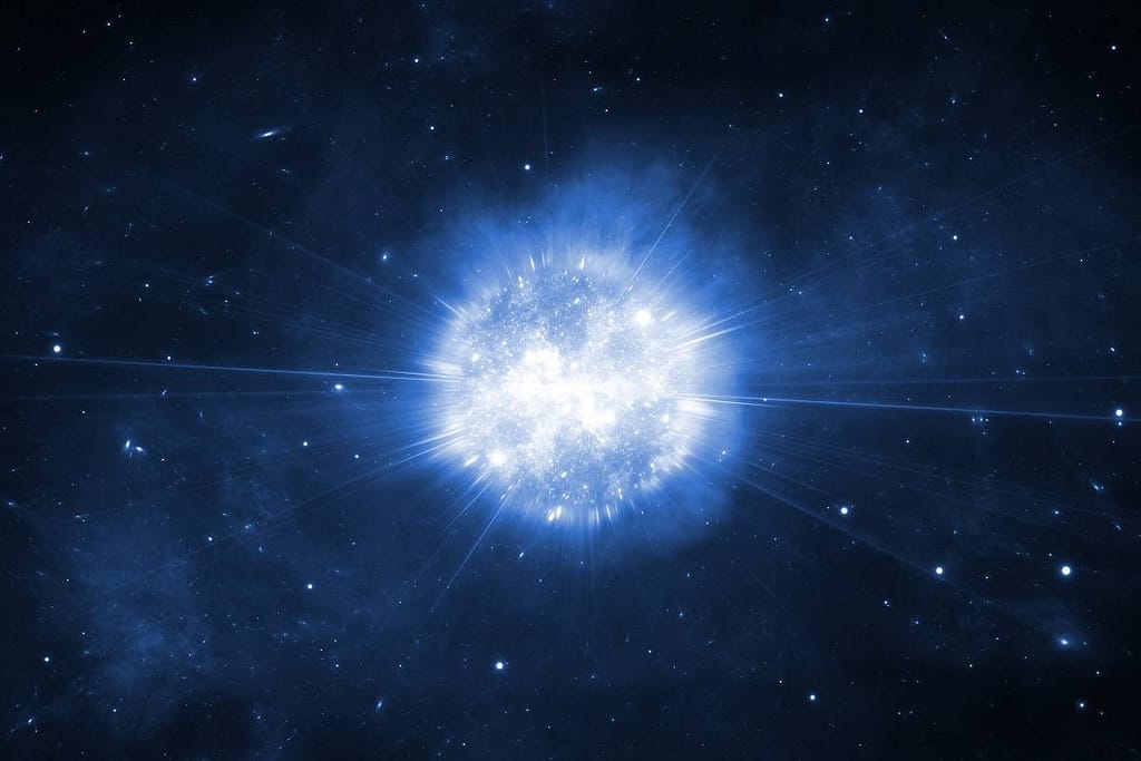 explosão de supernova no espaço, com nuvens de gás e poeira brilhando em tons vibrantes de azul, vermelho e laranja. A intensa liberação de energia ilumina a escuridão do cosmos, criando um espetáculo cósmico de luz e cor.