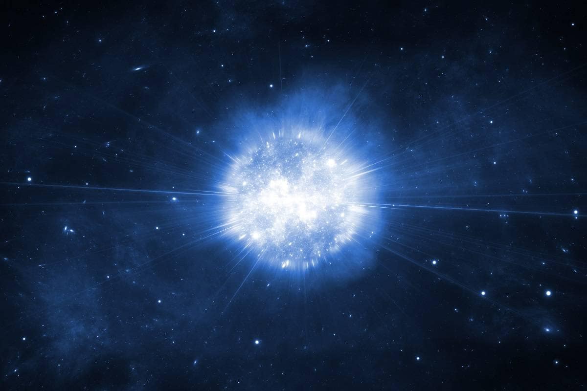explosão de supernova no espaço, com nuvens de gás e poeira brilhando em tons vibrantes de azul, vermelho e laranja. A intensa liberação de energia ilumina a escuridão do cosmos, criando um espetáculo cósmico de luz e cor.