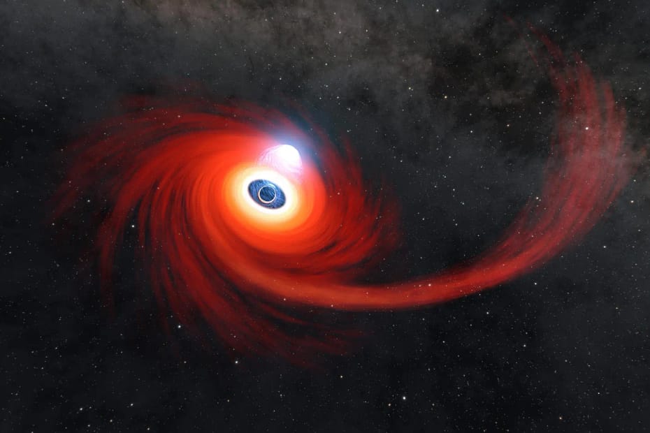 Ilustração artística de um buraco negro supermassivo devorando uma estrela. A imagem mostra o disco de acreção em tons de vermelho e laranja intenso, com a matéria estelar sendo espiralada em alta velocidade ao redor do buraco negro, enquanto parte do gás é ejetada no espaço. O fundo estrelado representa o ambiente galáctico profundo.