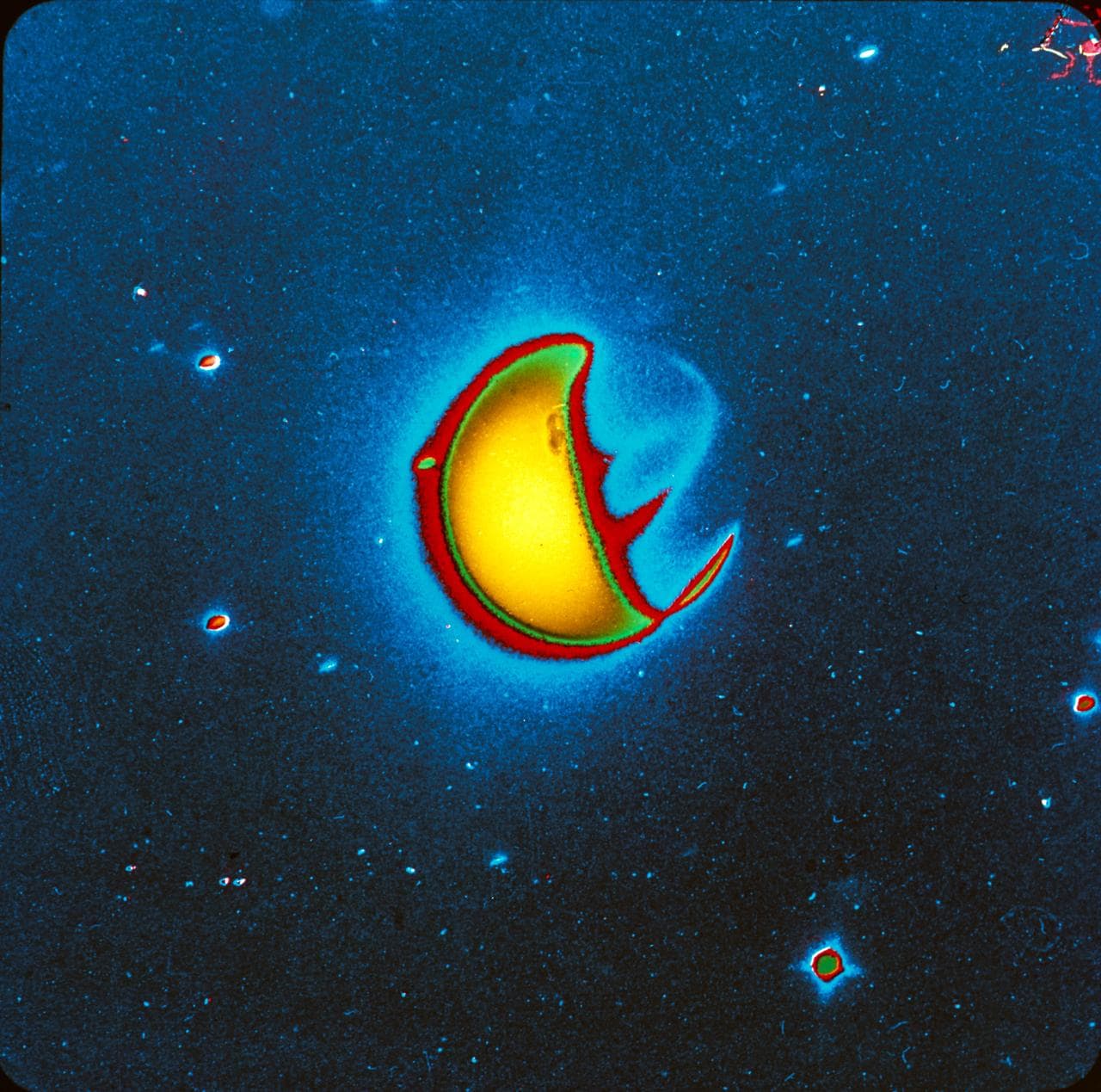 S72-40821 (21 April 1972) --- An artificially reproduced color enhancement of a ten-minute far-ultraviolet exposure of Earth, taken with a filter which blocks the glow caused by atomic hydrogen but which transmits the glow caused by atomic oxygen and molecular nitrogen. Note that airglow emission bands are visible on the night side of Earth, one roughly centered between the two polar auroral zones and one at an angle to this extending northward toward the sunlit side of Earth. The UV camera was operated by astronaut John W. Young on the Apollo 16 lunar landing mission. It was designed and built at the Naval Research Laboratory, Washington, D.C. EDITOR'S NOTE: The photographic number of the original black & white UV camera photograph, from which this artificially reproduced version was made, is AS16-123-19657.
Date Created:1972-06-06